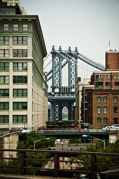 a bridge that is going over some buildings