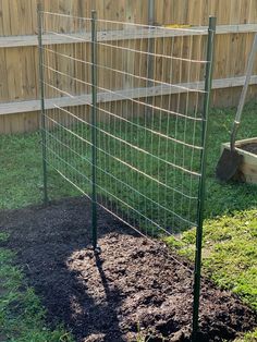 a garden fence is shown in the yard