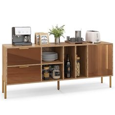 a wooden cabinet with plates, cups and other items on it's sideboard