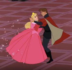 a man and woman dressed as princesses dancing