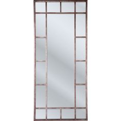 a tall mirror sitting on top of a white wall