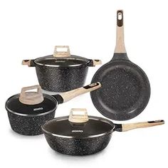 an assortment of black pots and pans with wooden handles