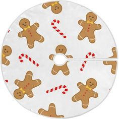 a white christmas tree skirt with gingerbreads and candy canes