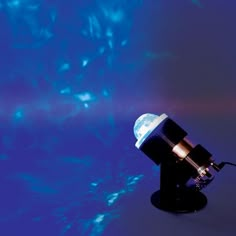 an image of a telescope in front of a blue background