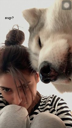 a woman is taking a selfie with a husky dog on her head and the caption says, what's up?