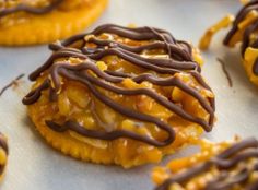 several cookies with chocolate drizzled on them