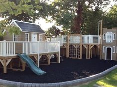 there is a play area in the park that has been built with wood and plastic