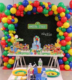 an american street birthday party with balloons and cake