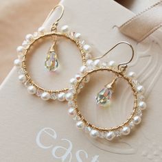 These hoop dangles are wrapped in a delicate fusion of shimmering crystals and pearls. Their versatile design makes them the perfect accessory to enhance your look, whether it's a little black dress, a beachy boho ensemble, or your special wedding attire. A Little Black Dress, Diy Jewelry Inspiration, Beachy Boho, Jewelry Lookbook, Austrian Crystal, Your Special, Wedding Attire, Beaded Earrings, Jewelry Inspiration