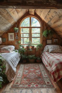 there are two beds in the attic with plants on each bed and an area rug