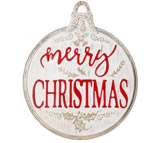 a merry christmas ornament hanging on a wall