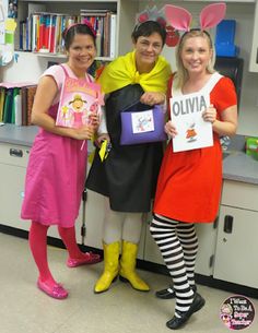 three girls dressed up in costumes posing for the camera