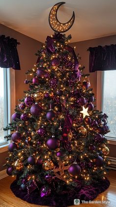 a decorated christmas tree with purple and gold ornaments