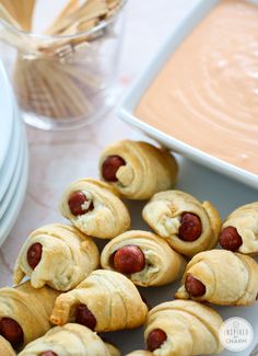 hotdogs wrapped in crescented bread with dipping sauce