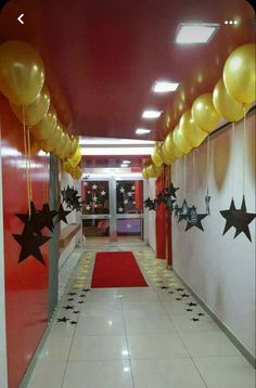 a hallway decorated with balloons and stars