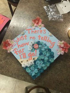 a decorated cap with flowers and words on it that says, just there's how no telling for all go