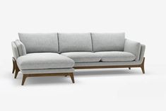 an image of a couch and ottoman in the same color as it appears to be white