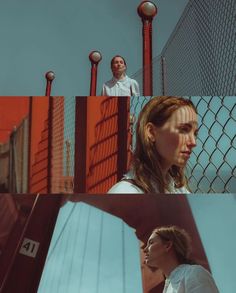 two people standing in front of a fence and looking at each other with the same person behind them