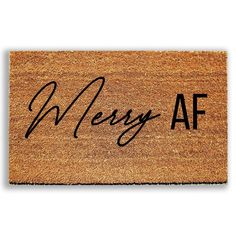 a door mat with the words messy af on it in black ink, against a white background