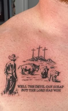 a man with a tattoo on his chest that says, well the devil can scrape but the lord has won