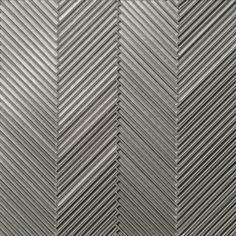 a close up view of a metal textured wallpaper with diagonal lines in grey and white