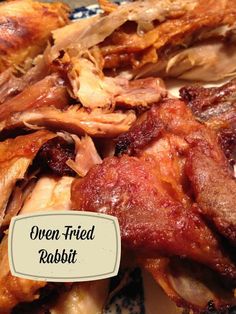 an oven fried rabbit is on a blue and white plate with the words oven fried rabbit above it