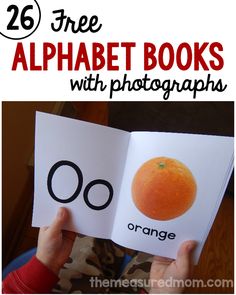 a person holding an open book with oranges on it and the title overlay reads 26 free alphabet books with photographs