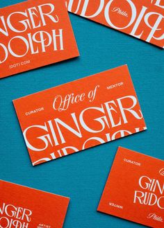 orange and white business cards with the words ginger dolph written on one side