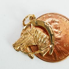 In good vintage condition, pre-owned.  weight: 1.5g - Gold Tested  Measures approx. 9/16 inches - See photos for details.  Please visit our Solid Gold collection : https://www.etsy.com/ca/shop/RetroCite?section_id=35062335 **We do not use any filters for our pictures and try to capture the real colors of the item. What you see is what you get! Don't hesitate if you have questions** Gold Collection, Horse Head, Gold Charm, Good Luck, Charm Pendant, Solid Gold, Jewelry Necklace Pendant, Filter, Fine Jewelry