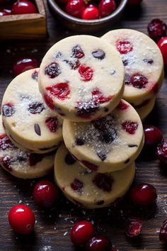 cranberry shortbreads with powdered sugar and cherries on the side