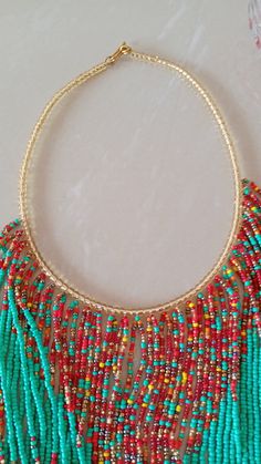 African Beaded Fringe Necklace, Multistrand Necklace, Beaded Jewelry, Women Jewelry, Tribal Necklace, African Jewelry, Gift For Her This statement necklace is superbly crafted which makes you stand out. Main color - turquoise green. Closure: hook Available in different colors, please contact me. Neck width: 17 inches Fringe width 16 inches 3-5 days delivery via DHL Express Colors of your choice can be customized,please contact me. Feel free to send me a convo or e-mail for any clarification or m Multi-strand Necklaces With Spacer Beads For Jewelry Making, Multi-strand Colorful Beaded Necklaces For Festive Occasions, Festive Multi-strand Beaded Necklaces With Colorful Beads, Handmade Multi-strand Beads For Festive Occasions, Handmade Multi-strand Festive Beads, Festive Handmade Multi-strand Beads, Colorful Beads Multi-strand Bib Necklaces For Jewelry Making, Colorful Beads Multi-strand Bib Necklace For Jewelry Making, Festive Multi-strand Beaded Necklaces