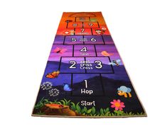 a children's play mat with numbers and animals on it in the shape of a ladder