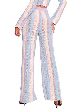 Colorful stripes enhance the breezy vibe of these kick-flare cover-up pants designed with a ribbed waist and a drawstring closure. Drawstring waist 100% acrylic Hand wash, dry flat Made in Peru Hispanic & Latinx Owned/Founded Spring Striped Flare Bottoms, Spring Flare Striped Bottoms, Striped Flare Bottoms For Spring, Crochet Collection, Crochet Cover Up, Kick Flares, Pants Design, Paloma, Drawstring Waist