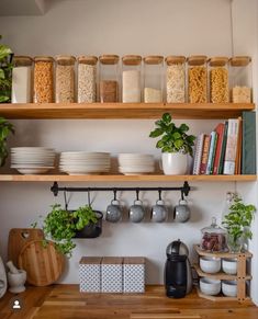 the shelves in this kitchen are filled with food