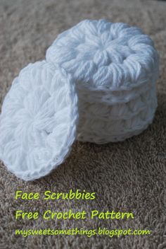 two crochet scrubbies sitting on top of each other in the middle of carpet