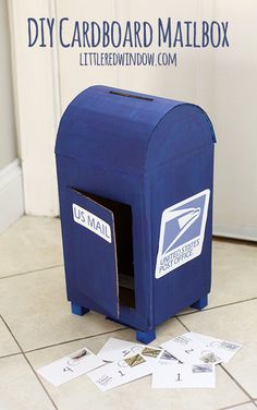 a blue mailbox sitting on top of a tiled floor