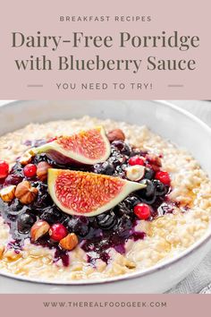 a bowl filled with oatmeal topped with blueberries and figs