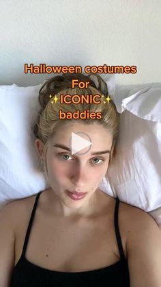 a woman laying in bed wearing a black tank top with halloween costumes for iconic baddies