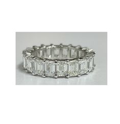 Essential Collection This L Setting Style Emerald Cut Diamond Eternity Band ring is a timeless, elegant and gleaming that goes all the way around is beautifully set on this shared 14k white prong design. We only use Natural stones. This would be suitable for Wedding Bands, Anniversary or even Push Gifts. It's a ring that you can wear in any occasions and goes well with any outfit. Fancy shape eternity bands are more expensive than rounds due to the fact that each stone has to be matched for colo Luxury Platinum Eternity Band With Baguette Cut, Elegant Lab-grown Diamond Eternity Band For Anniversary, Elegant Lab Grown Diamond Eternity Band For Anniversary, Formal Eternity Band With Halo Design And Round Cut, Octagon Diamond Wedding Ring In Platinum, Formal Round Cut Eternity Band With Halo Design, Silver Emerald Cut Halo Wedding Ring, Elegant Diamond White Lab Grown Diamond Eternity Band, Elegant Eternity Band With Halo Design