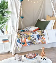 a bedroom with a canopy bed and toys on the floor