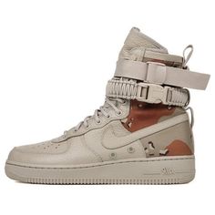 The Nike SF Air Force 1 'Desert Camo' is a modern take on the classic AF1 silhouette. Featuring a unique lacing system and military-inspired elements, this sneaker is designed for outdoor activities. The Khaki upper is made of ballistic nylon for a combination of comfort and durability. The Chino/Classic Stone-Lt British Tan colorway adds a stylish touch to the sneaker, while the rubber sole ensures maximum traction. The Nike SF Air Force 1 'Desert Camo' is perfect for those who want to add a touch of military style to their wardrobe. (AF1/SNKR) Nike Combat Lace-up Boots, Combat High-top Leather Desert Boots, Nike Combat Leather Boots, Nike Leather Combat Boots, Nike Combat Boots For Streetwear, Combat Sports Sneakers, Combat Style Lace-up Sports Sneakers, Military Style Leather Boots For Streetwear, Khaki Lace-up Boots For Streetwear