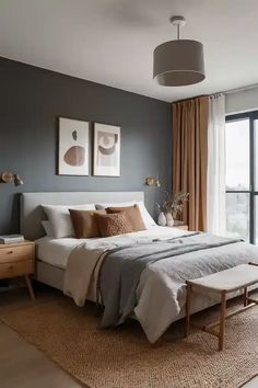 a bedroom with gray walls and white bedding