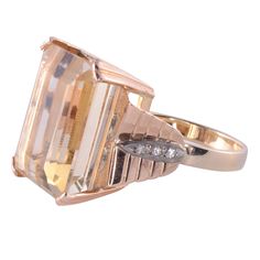 Vintage 27.21 carat citrine ring, circa 1945. This 10 karat yellow and rose gold ring features a 27.21 carat emerald cut citrine, accented with 6 diamonds at .06 carat total weight. These diamonds have I1 clarity and I color. This citrine rine is a size 9.75 and is appraised at $1,978. Item #MICO 822 1 Carat Diamond Ring, November Birthstone Ring, Old Rings, Ring Vintage, Vs Diamond, Diamond Cocktail Rings, Citrine Ring, Citrine Stone, Solid Gold Rings