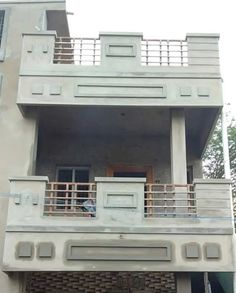 an apartment building with balcony and balconies