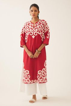 Red silk chanderi straight kurta with cotton applique work at neck, hem and sleeves, highlighted with kantha hand work. Comes with off white cotton wide leg pant with side pockets. 
Components: 2
Pattern: Embroidered
Type Of Work: Trellis Jaal Appliques
Neckline: Notched
Sleeve Type: Three Quarter
Fabric: Silk Chanderi, Pant and Lining- Cotton
Color: Red
Other Details: 
Lined kurta and pant
Side pocketed kurta and pant
Back elasticated pant
Closure: Pant: Front drawstrings
Occasion: Work,Puja - Red Block Print Kurta For Designer Wear, Designer Red Block Print Kurta, Red Block Print Straight Kurta, Red Straight Kurta With Block Print, Red Block Print Traditional Wear For Navratri, Festive Red Kurta With Block Print, Eid Red Kurta With Block Print, Festive Motifs Kaftan, Traditional Red Kaftan Straight Kurta