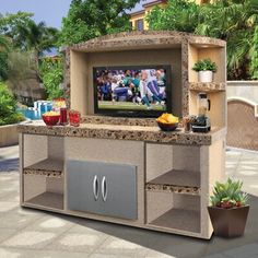 an outdoor grill with a television on it