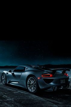 a black sports car parked in the dark