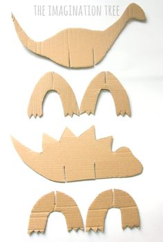 three pieces of cardboard cut out to look like alligators