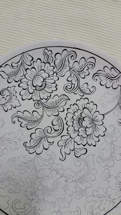 a plate with black and white designs on it