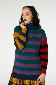 Embrace effortless style with this Chunky Oversized Knit by Dangerfield. This cozy piece features long sleeves and a funnel neck, providing warmth and comfort for those chilly days. The side splits add a modern touch, allowing for easy movement and a relaxed fit. With eye-catching contrast stripe paneling, this knit stands out in vibrant purple and green hues, perfect for adding a pop of color to your wardrobe. Whether you're lounging at home or heading out for a casual day, this oversized knit Chunky Knit Long Sleeve Turtleneck For Layering, Striped Turtleneck Sweater For Layering, Green Funnel Neck Sweater For Fall, Chunky Knit Turtleneck With Funnel Neck For Layering, Striped Long Sleeve Turtleneck For Winter, Kids Scrubs, Raincoat Kids, Vibrant Purple, Leggings Kids